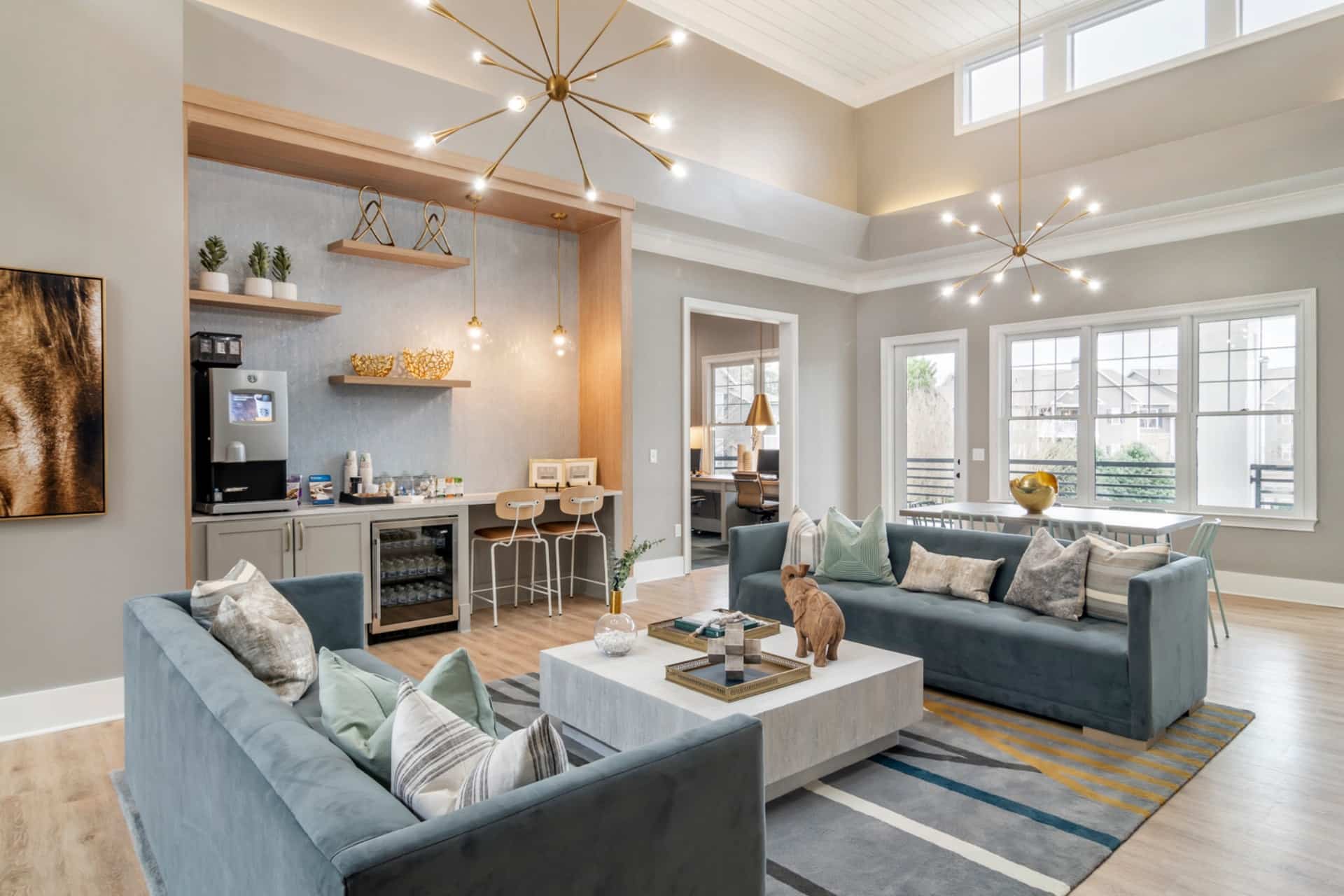 Clubhouse area with blue couches and decorative lighting