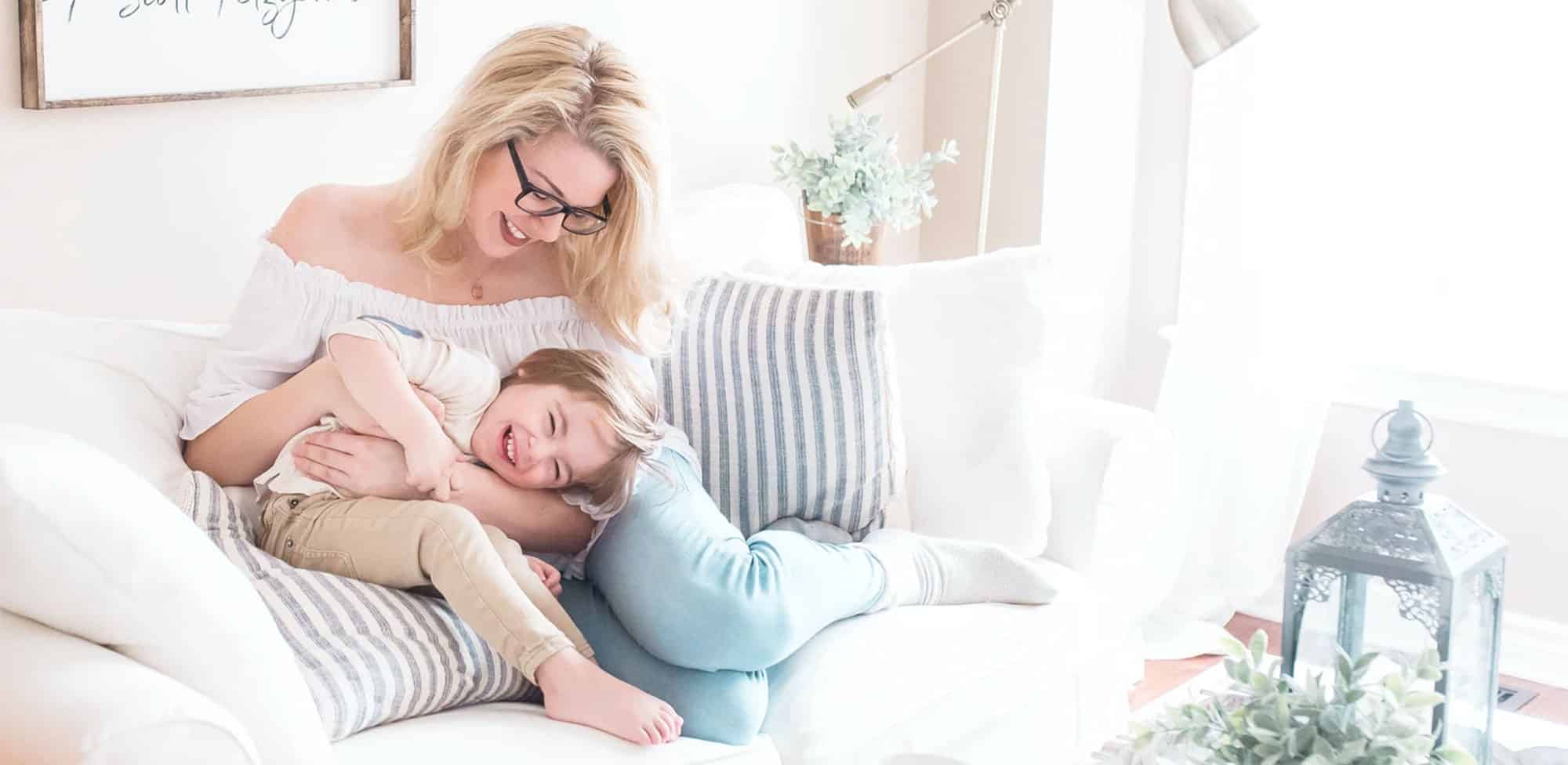 bell corporate plan 2020 A mom and daughter play together on a couch